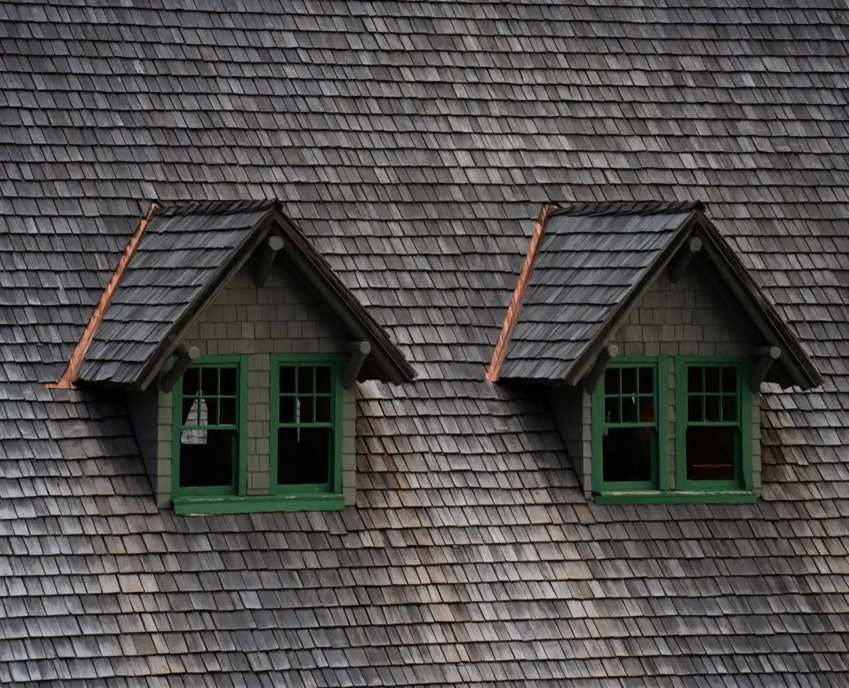 Dormers on a shingle roof in Dayton, OH, where step flashing and kickout flashing carry water past the walls